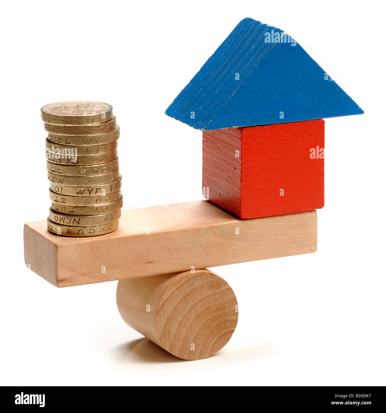 House and money seesaw Stock Photo