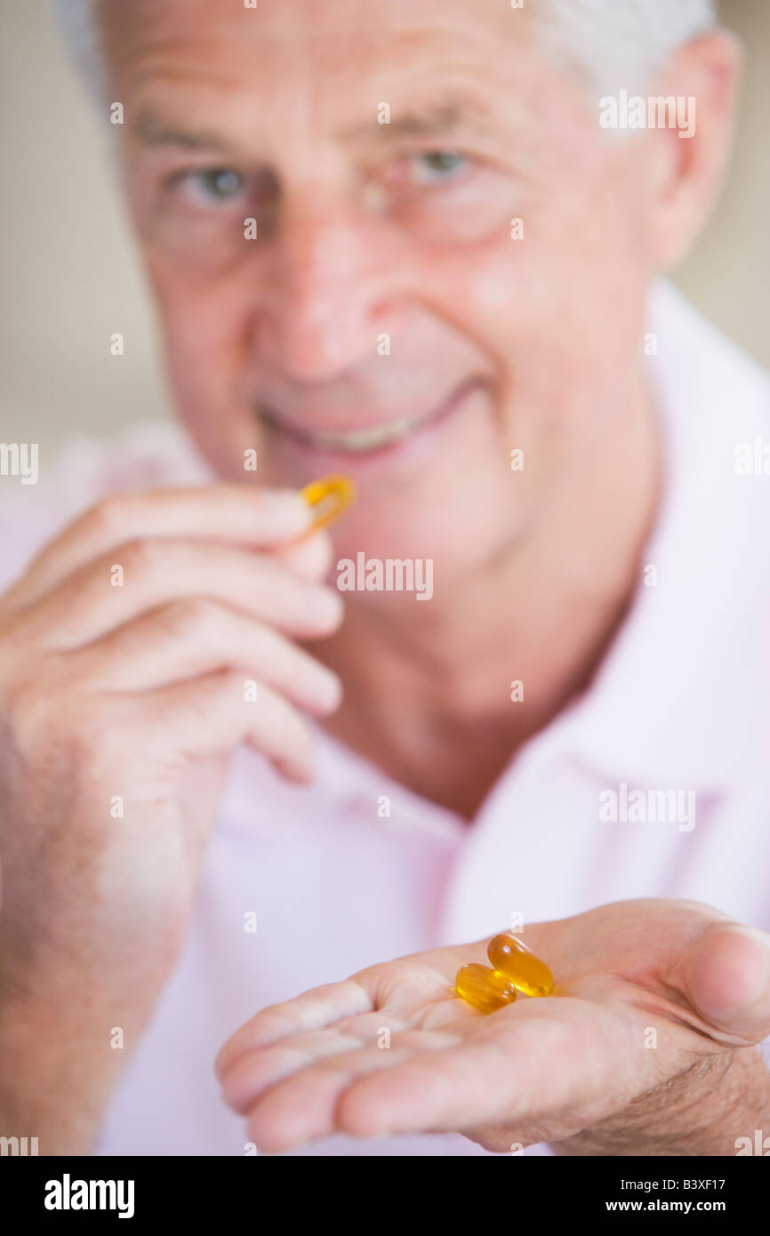 Man Taking Pills Stock Photo