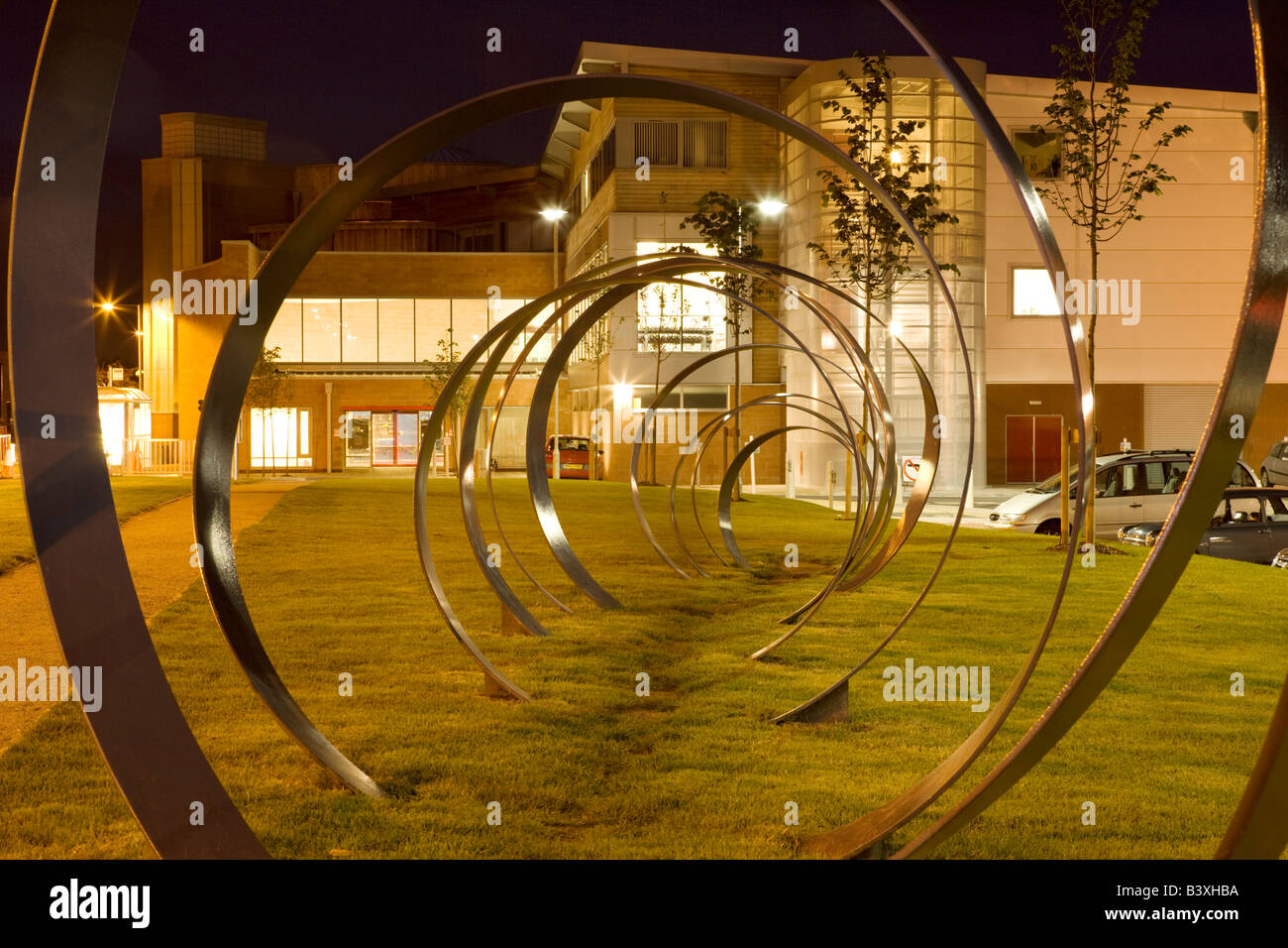 Dumfries town centre the Spring sculpture by Walter Jack at DG1 leisure complex at night Scotland UK Stock Photo