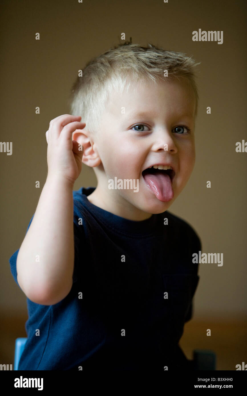 Little boy with his tongue sticking out Stock Photo Alamy