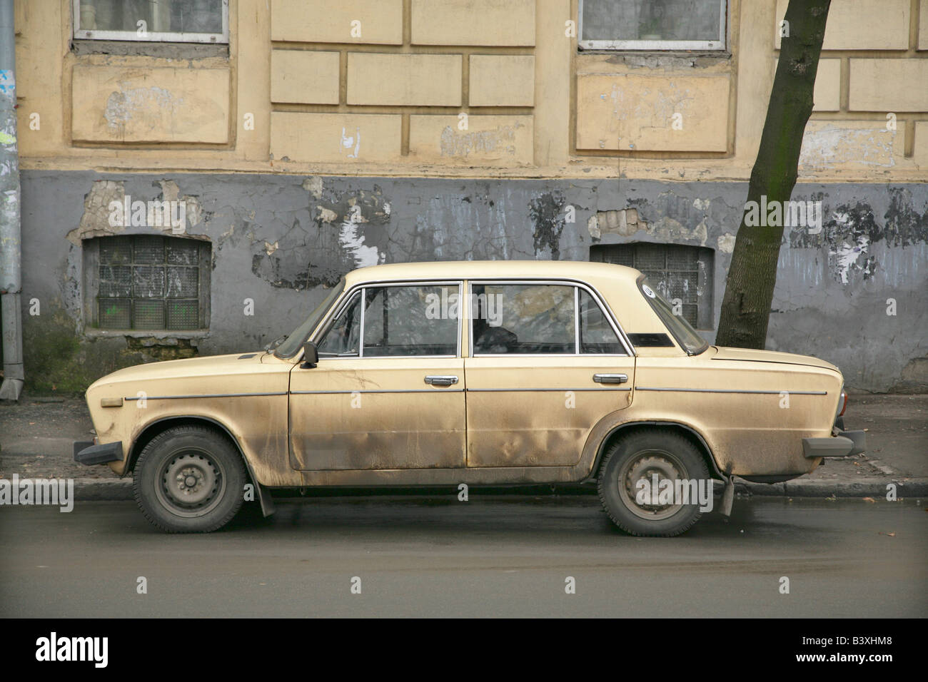Old dirty cream Lada saloon car in Lviv or Lvov, Ukraine Stock Photo
