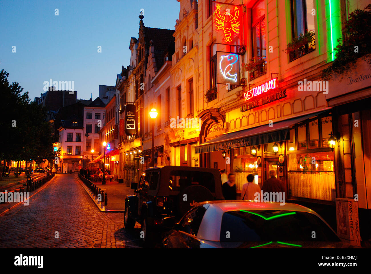 Alley of seafood restaurants near St Catherine church Brussels Belgium Stock Photo