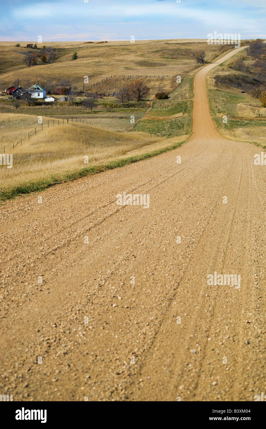 Winding country road and farm house near Glen Ullin North Dakota Stock