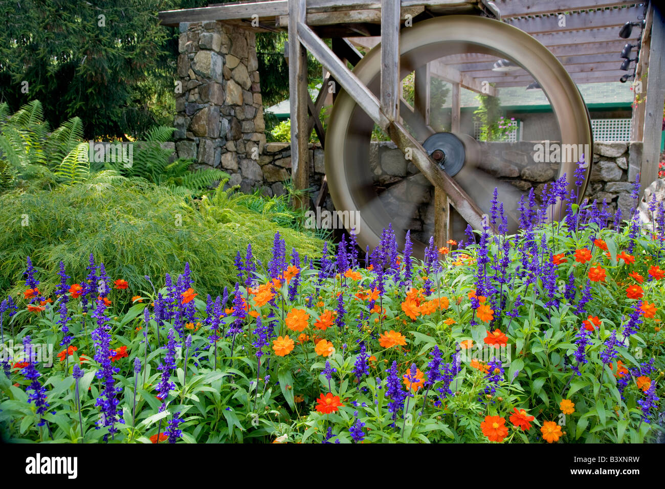 Water wheel and flowers at Butchart Gardens B C Canada Stock Photo