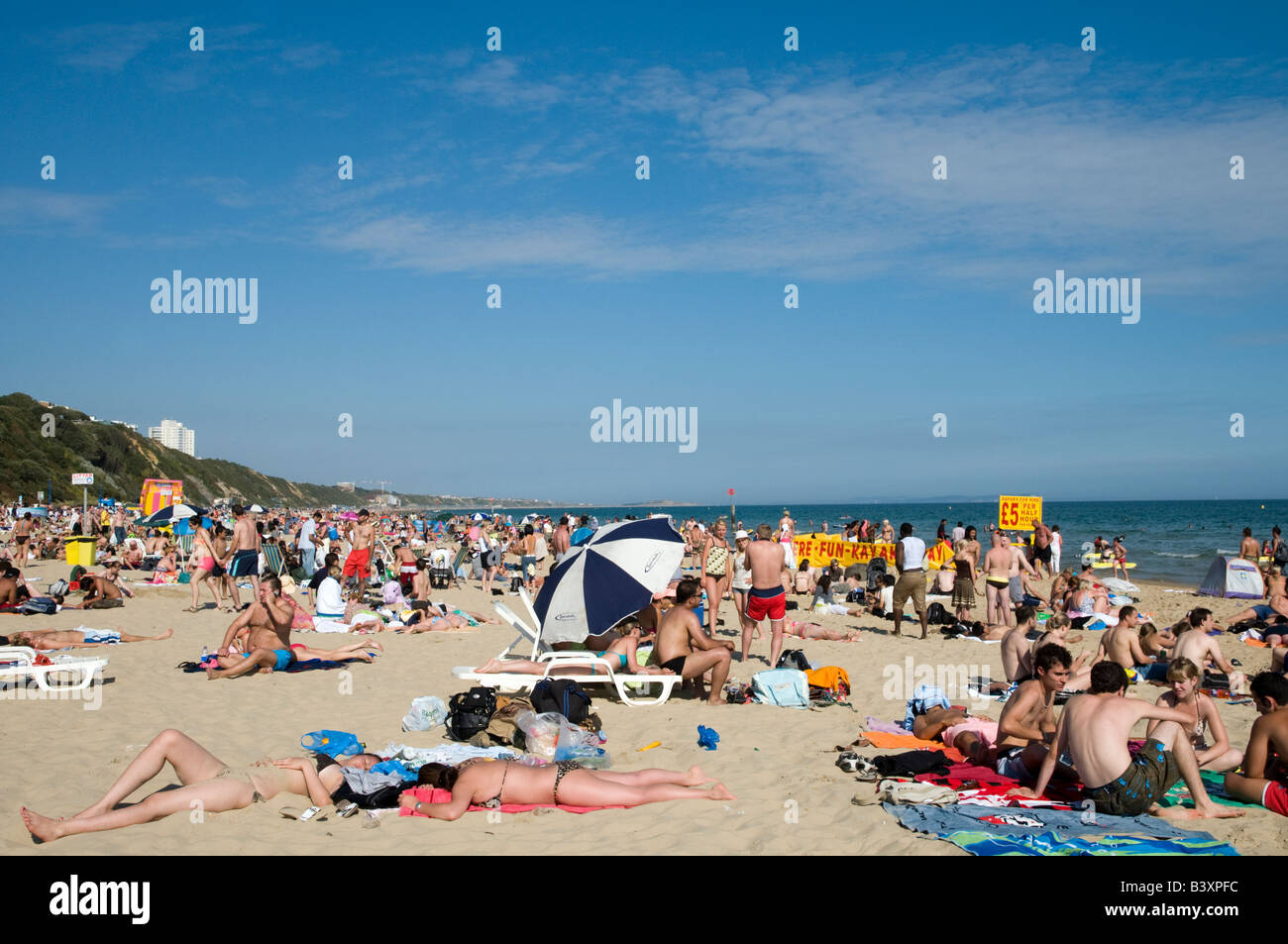 Crowded Bournemouth beach Dorset England UK Stock Photo
