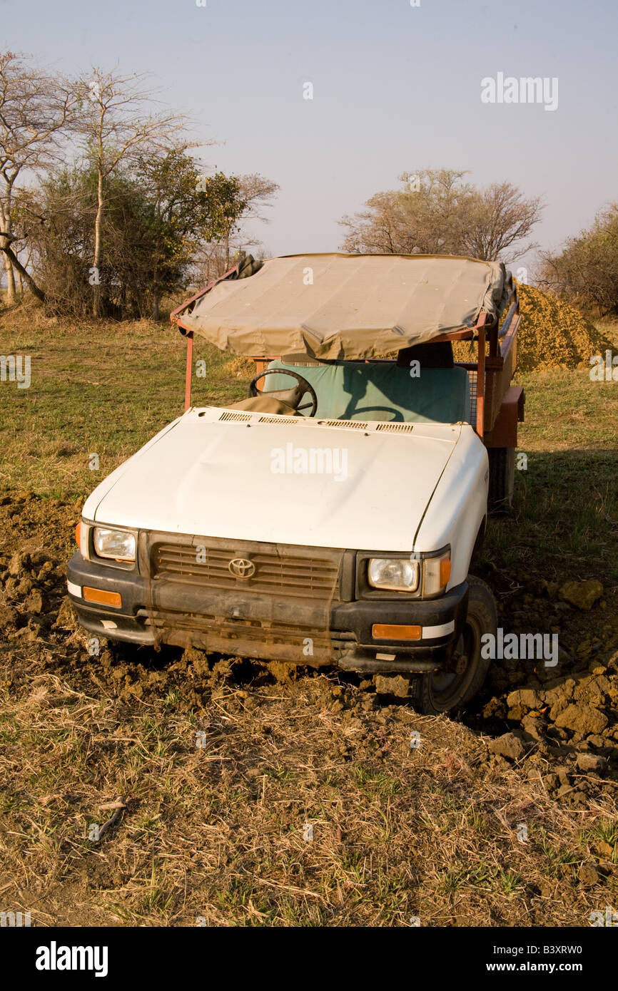 Toyota Hilux truck stuck in a mud ditch Zambia Africa Stock Photo