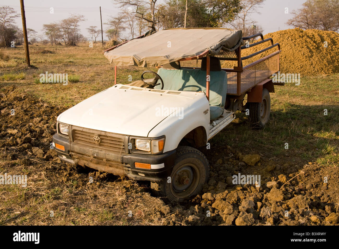 Toyota Hilux truck stuck in a mud ditch Zambia Africa Stock Photo