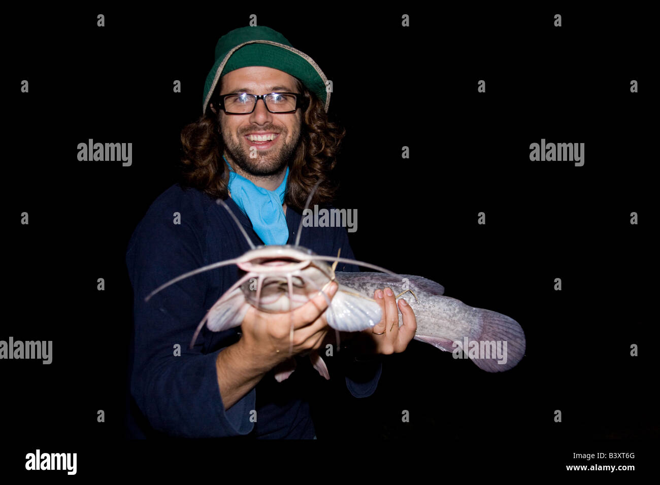 Man with a Large barbel catfish Kafuie Zambia Africa Stock Photo Alamy
