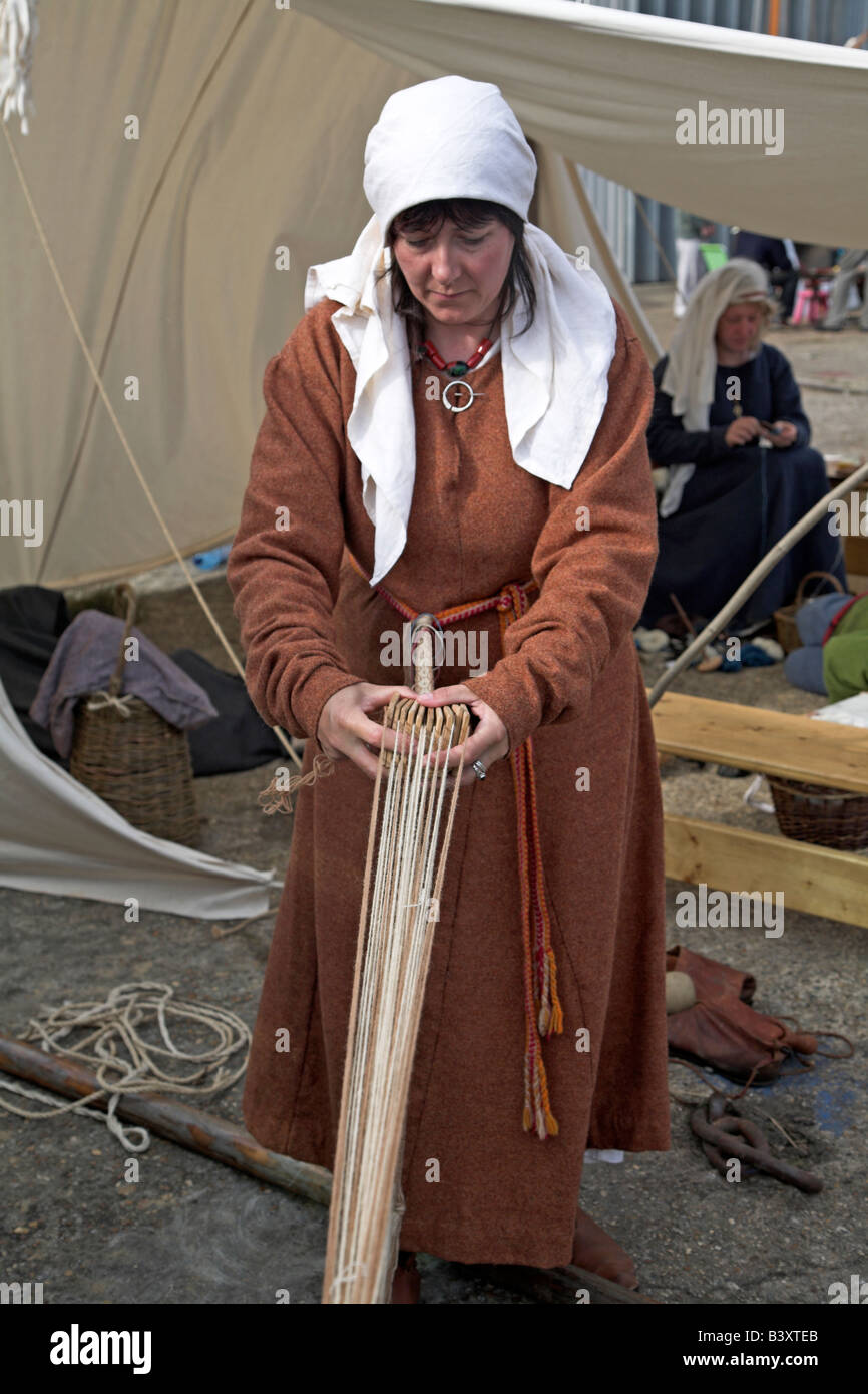 Viking woman weaving twine making string rope Stock Photo Alamy