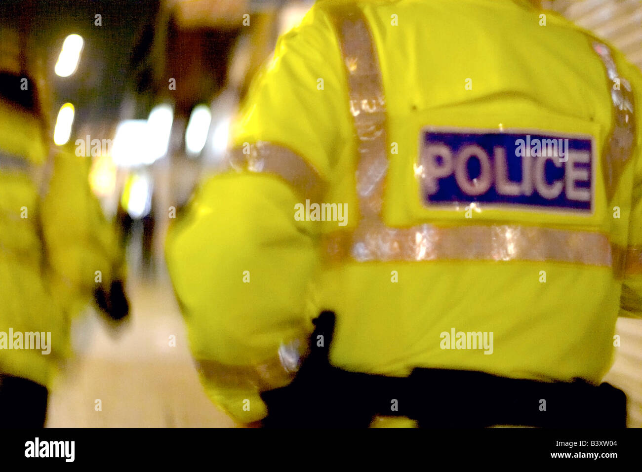 back of police officer on patrol at night Stock Photo Alamy