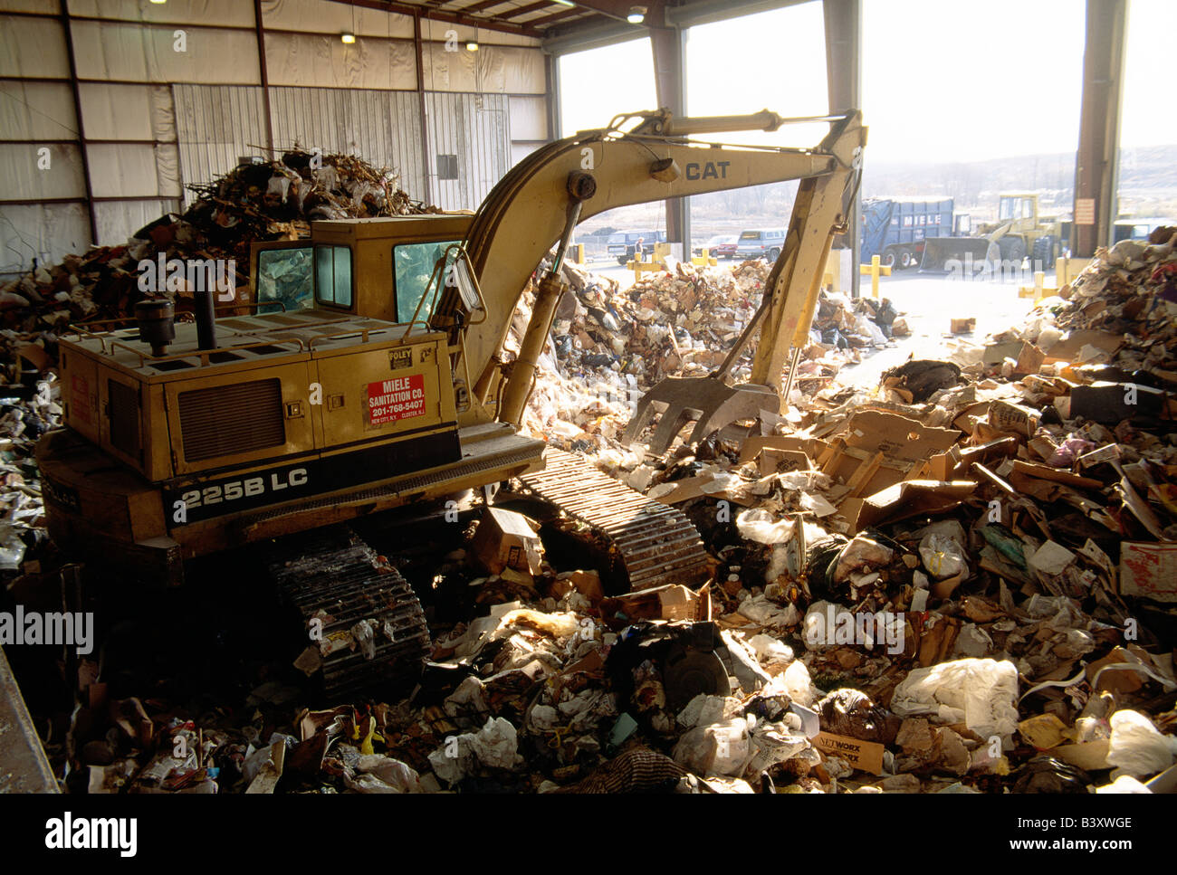 HEAVY EQUIPMENT WORKING AT A TRASH TRANSFER STATION, CLARKSTOWN