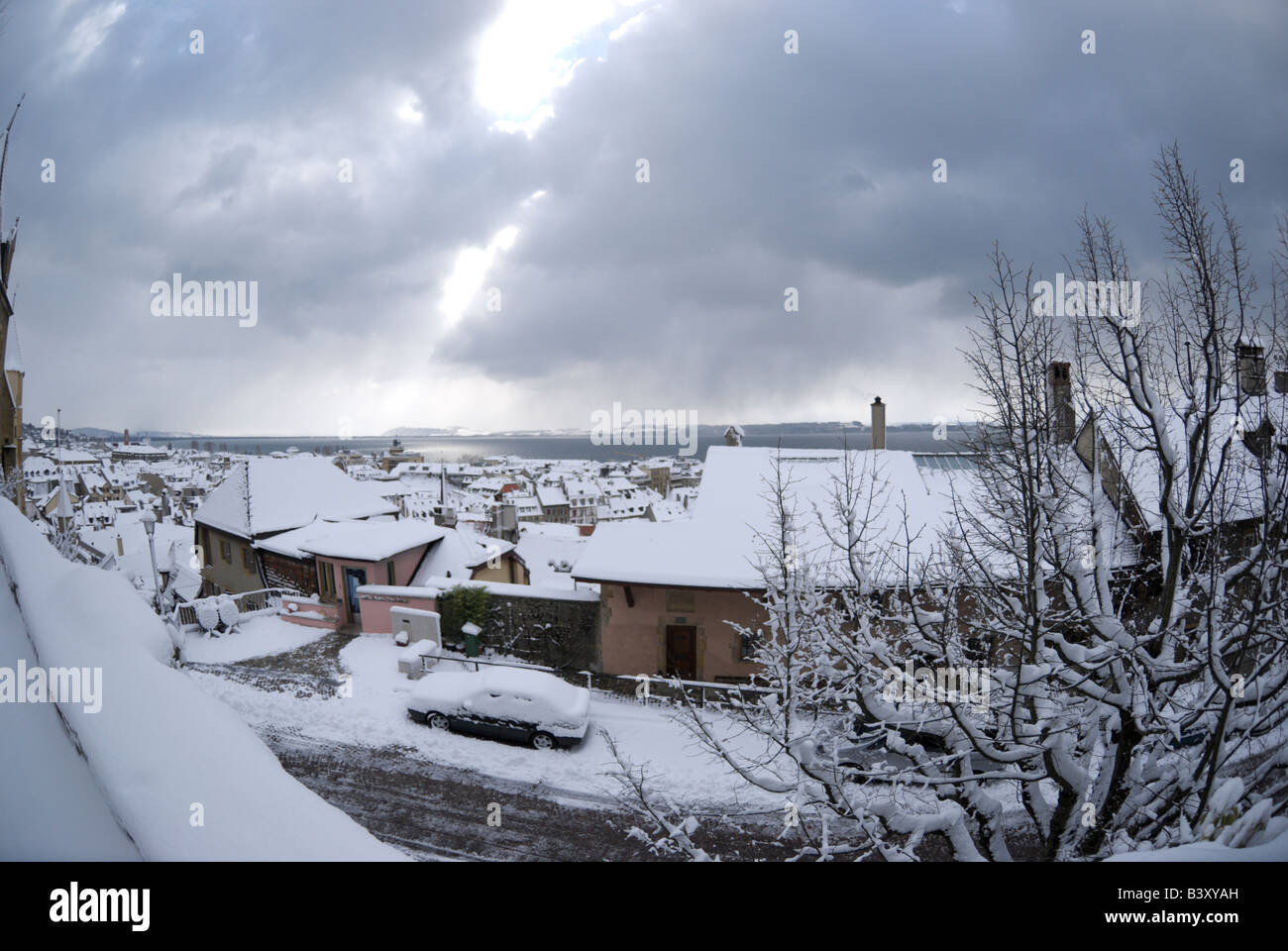 Looking out over the snow covered rooftops of Neuchatel after a winter storm Stock Photo