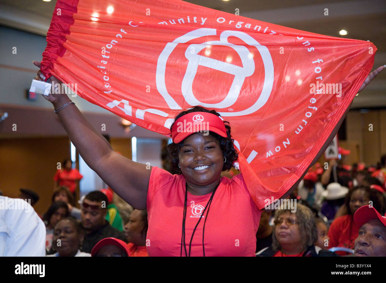 Detroit Michigan A woman waves an ACORN flag at the national convention of the community organization Stock Photo
