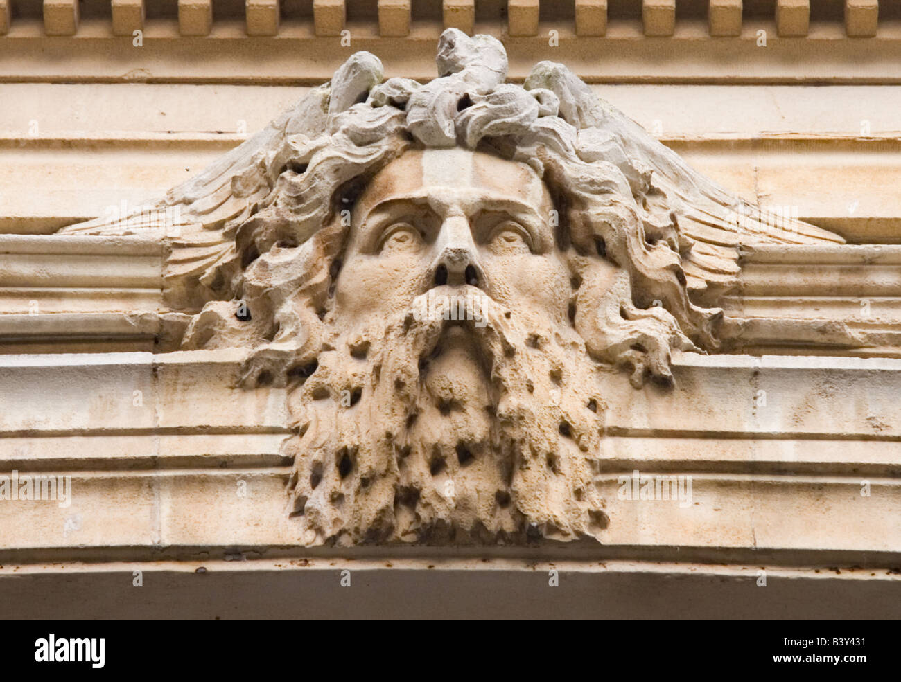 Sculpted head of a bearded man in a winged helmet.  York Street, Bath, England, UK Stock Photo