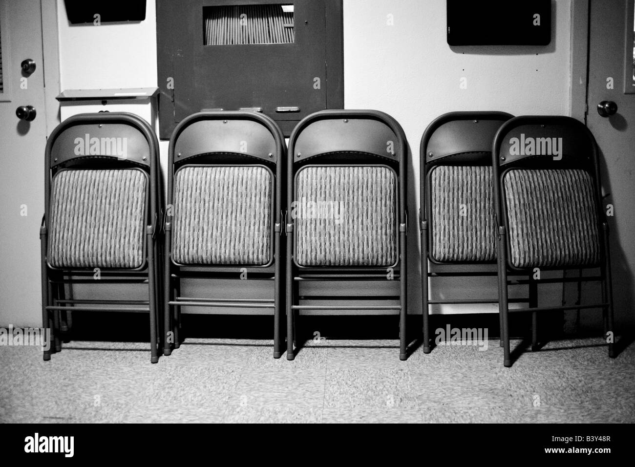 Chairs leaning against wall hires stock photography and images Alamy