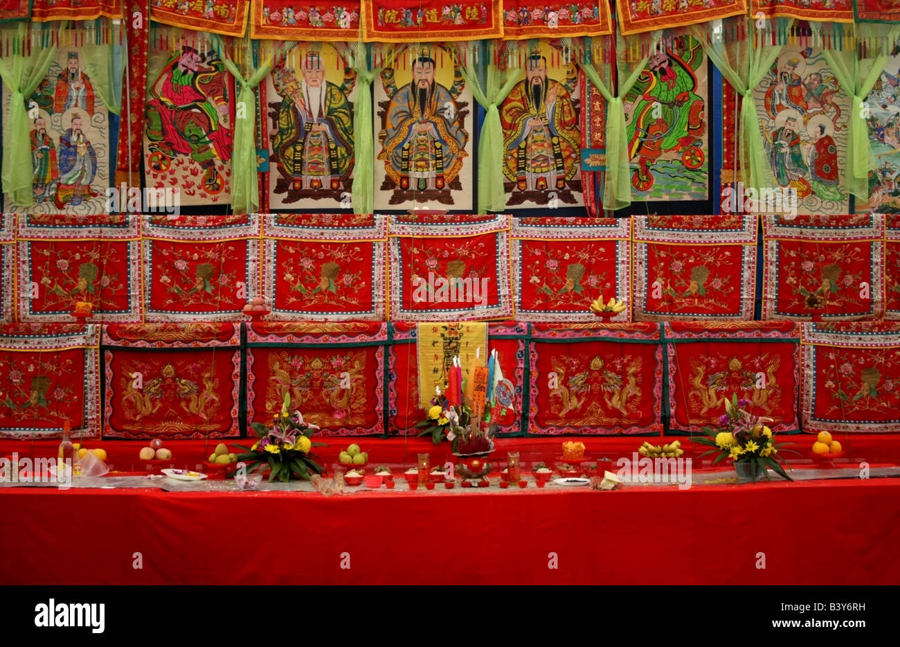 Alter of offerings with the Three Pure Ones and taoist deities, Taoist festival of the hungry ghosts, Singapore, South East Asia Stock Photo