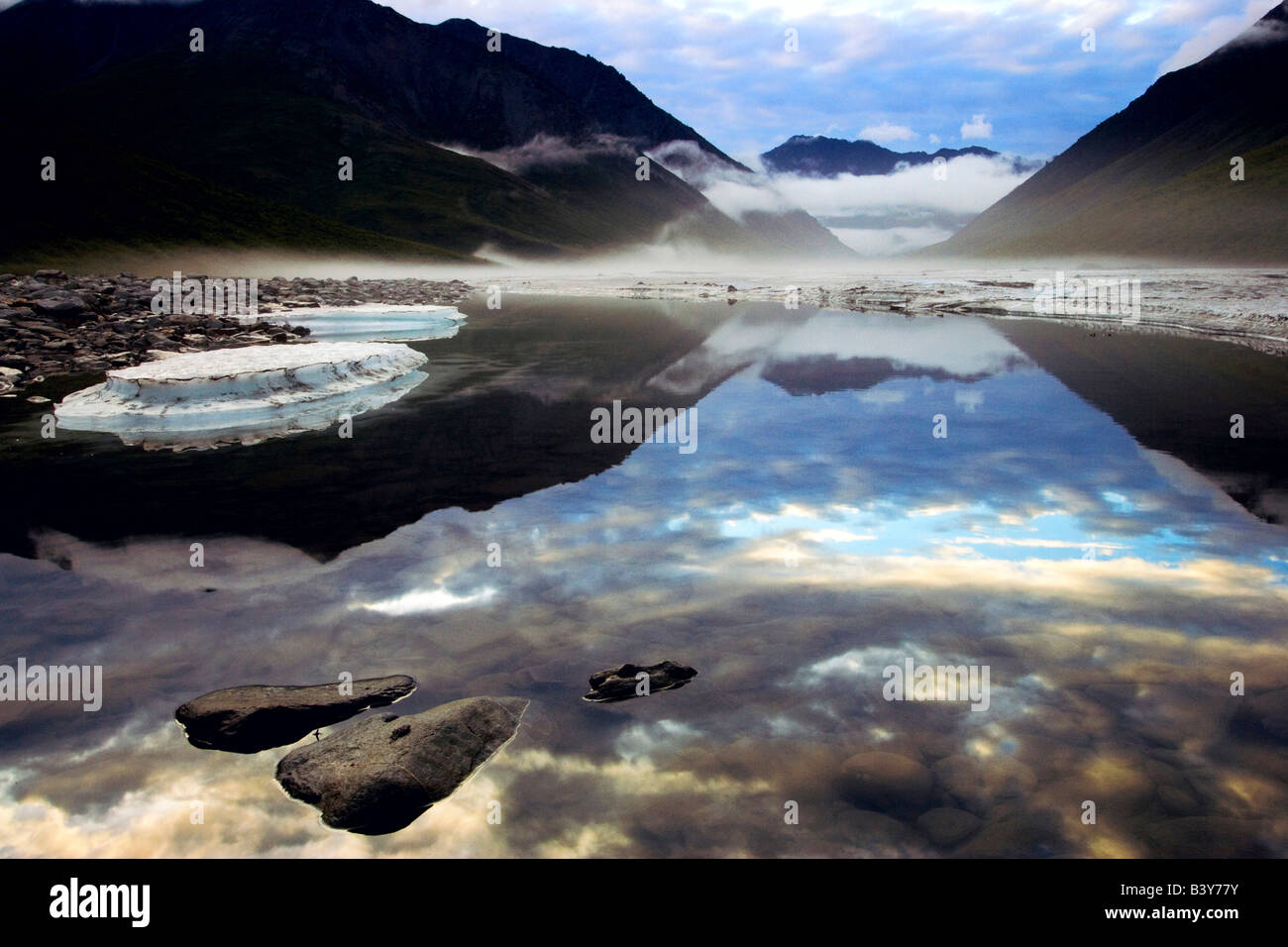 Fog forming in the Kongakut River valley as a storm passes at midnight in the Arctic National Wildlife Refuge of Alaska Stock Photo