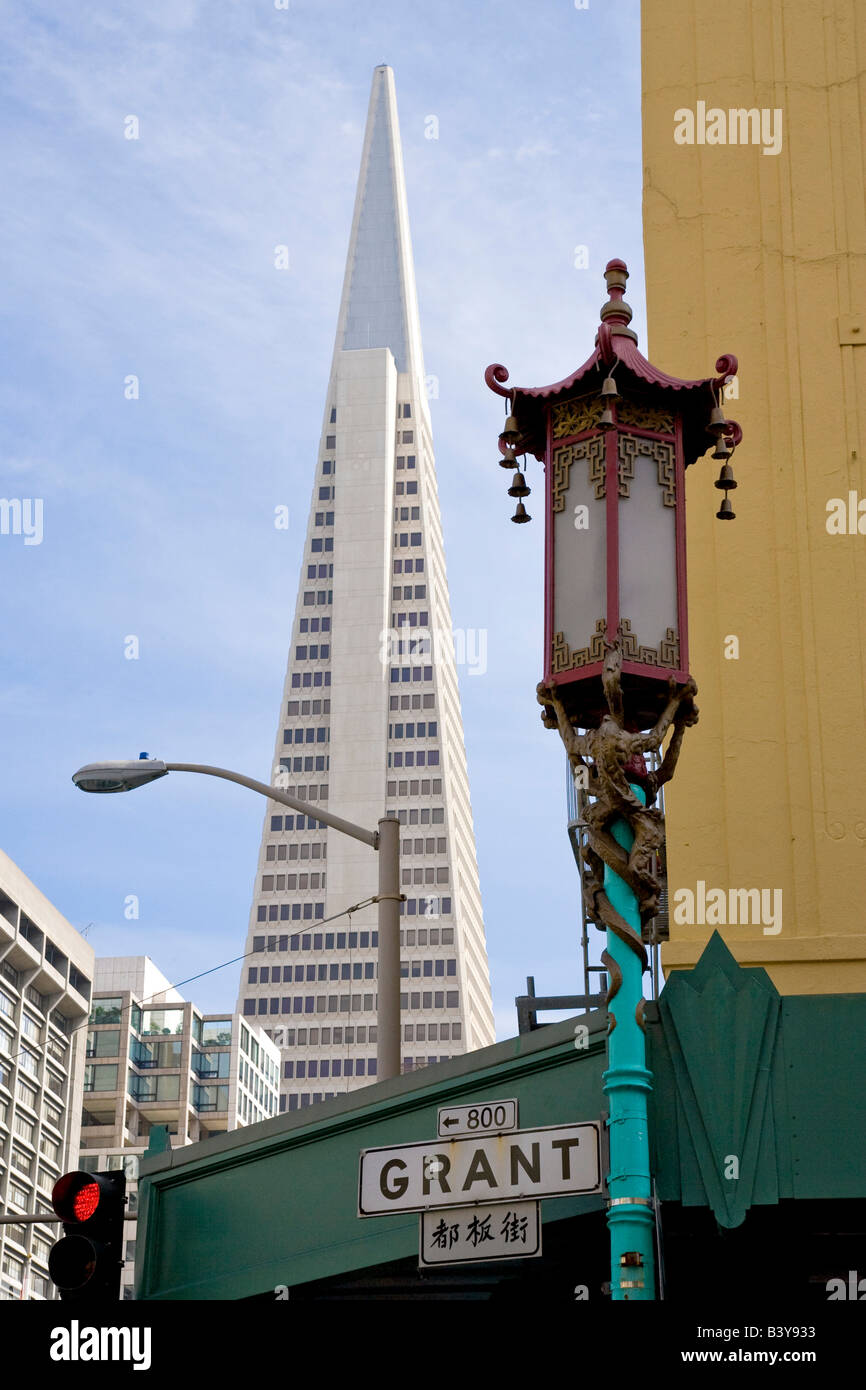 USA, California, San Francisco. East meets West with Chinatown lamppost and Transamerica building. Stock Photo