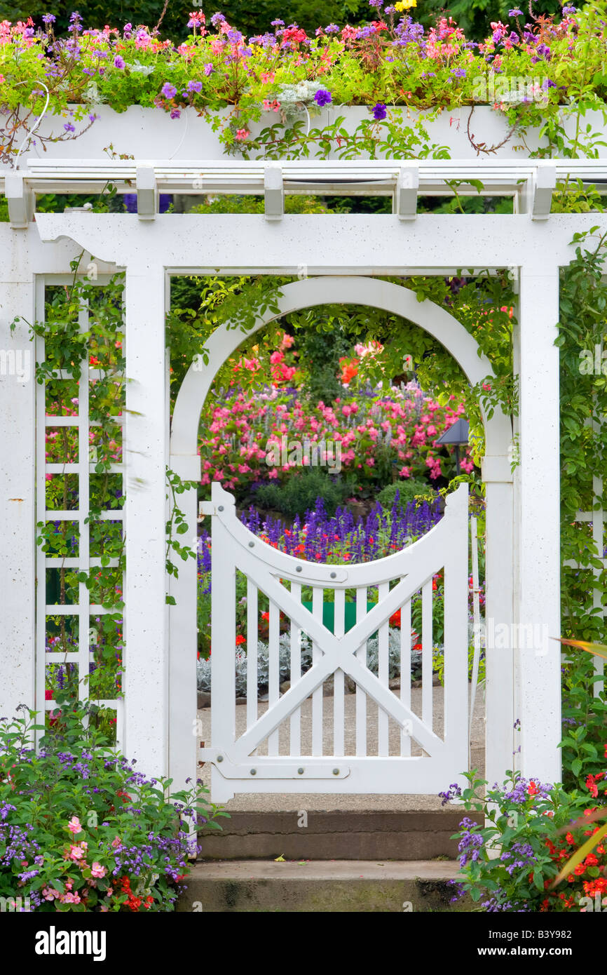 Gate with flowers at Butchart Gardens B C Canada Stock Photo
