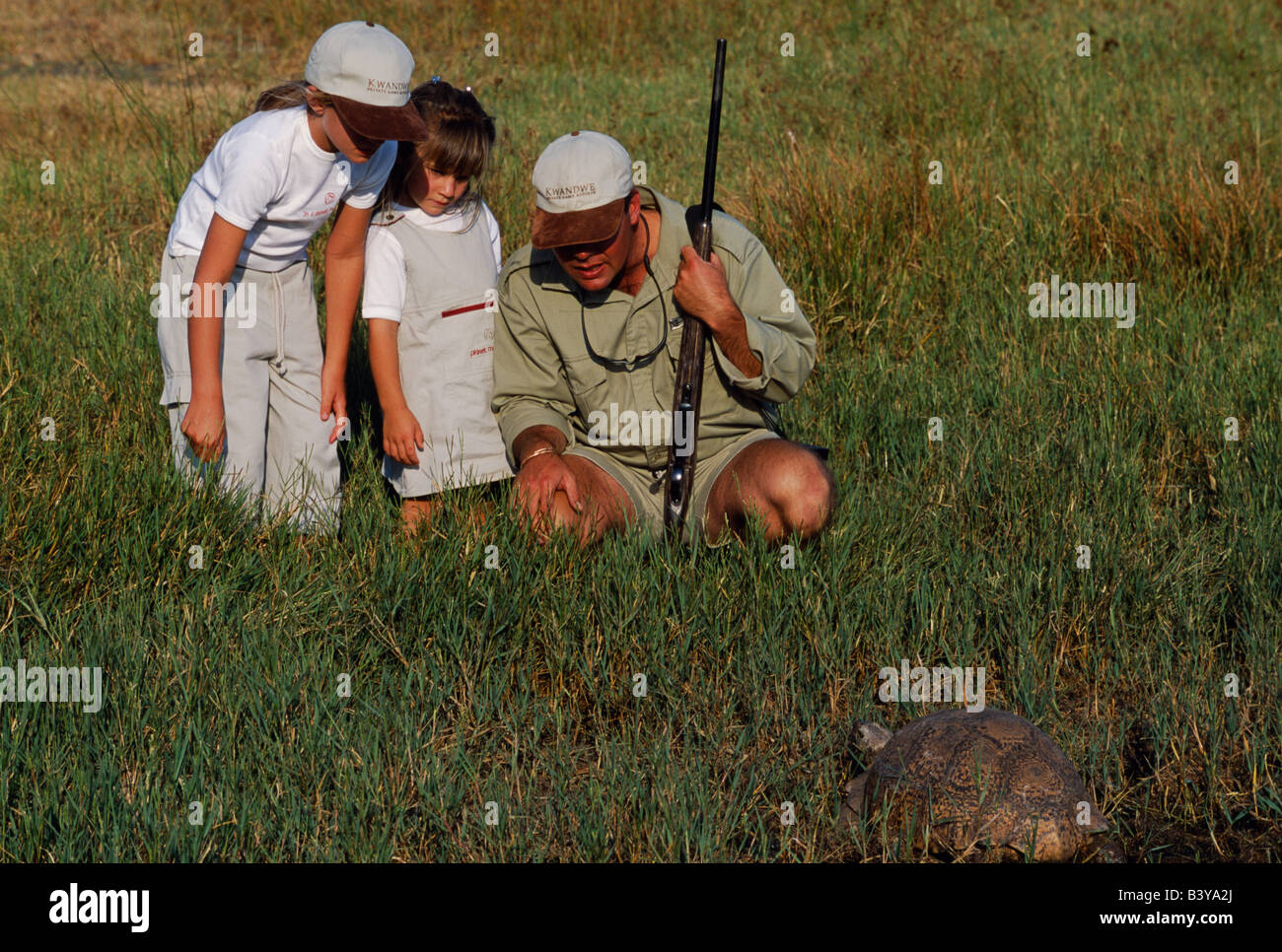 South Africa, Eastern cape, Kwandwe. Safari guide taking children on a