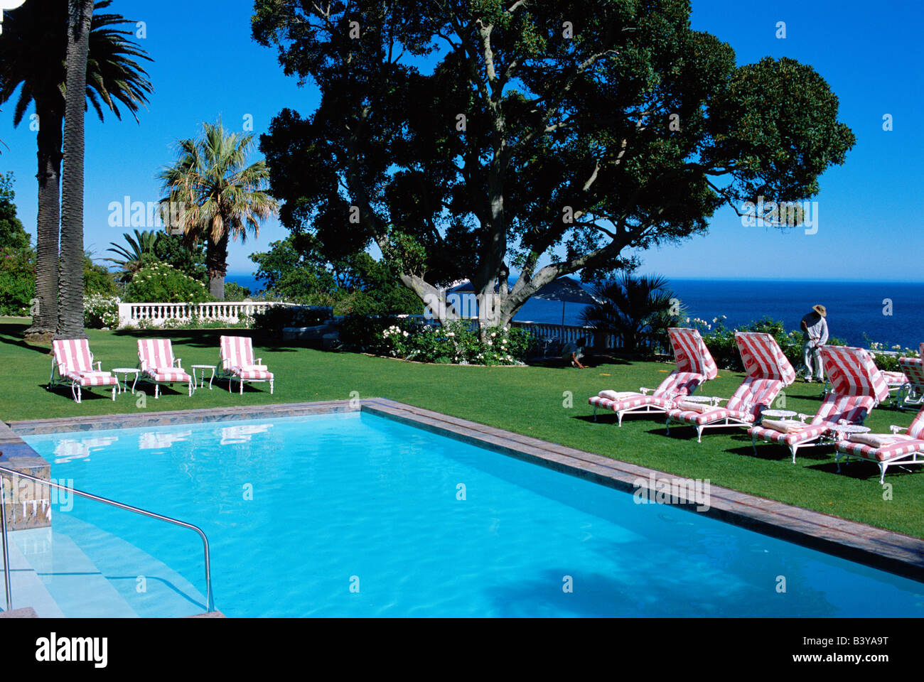 South Africa, Cape Town. Sun loungers set out round the swimming pool