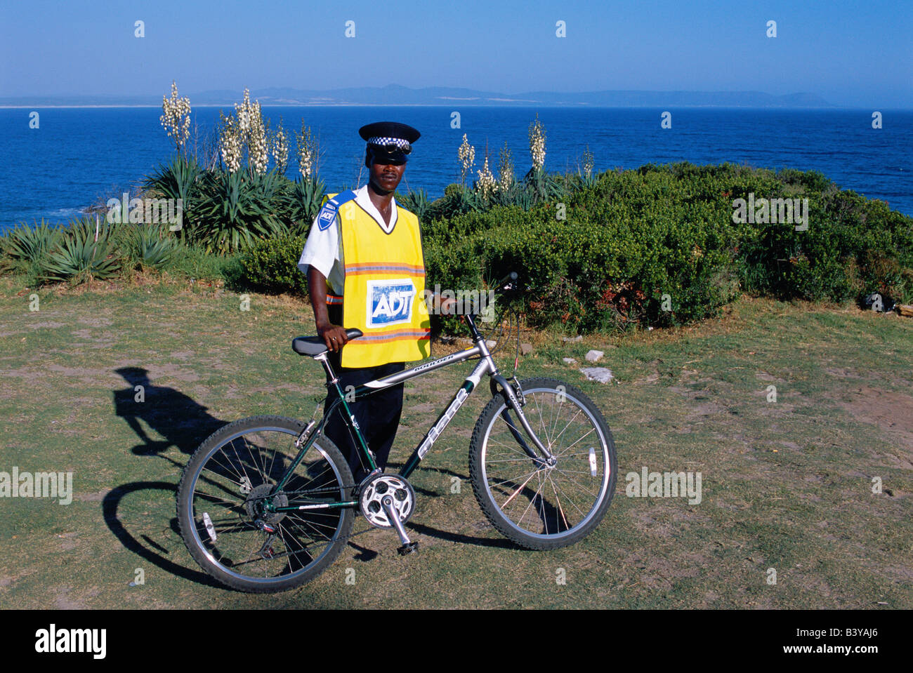 South Africa, Western Cape, Hermanus. Security Guard on patrol with his