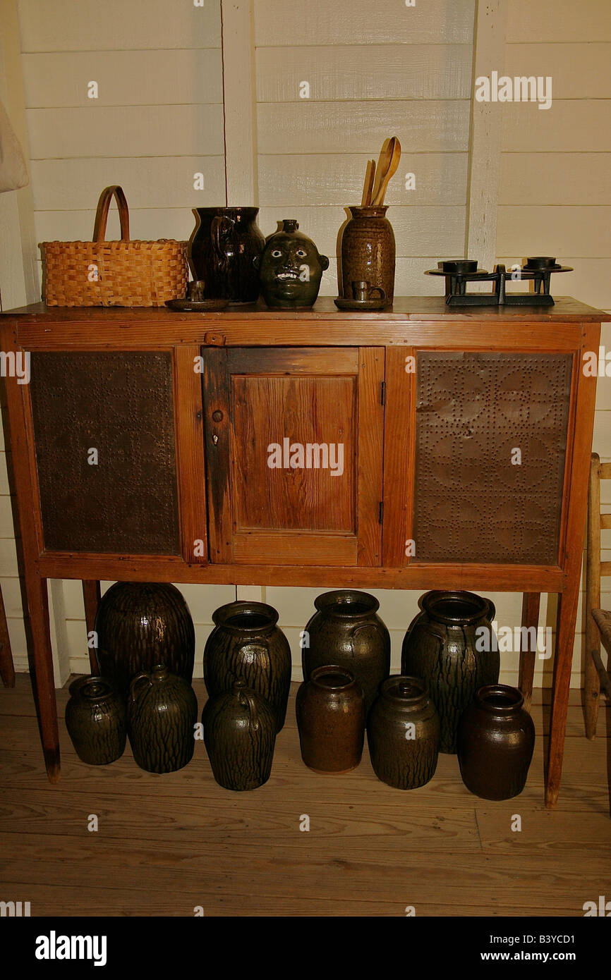 North America, USA, Georgia, Atlanta.  Pottery and furniture in the house at Tullie Smith Farm in the Atlanta History Center. Stock Photo