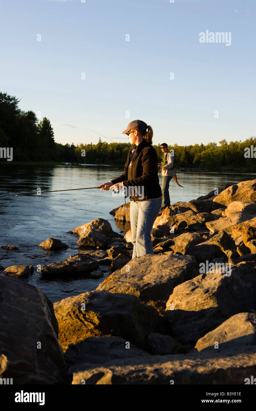 A couple flyfishing on the Moose River below the dam on Brassua Lake