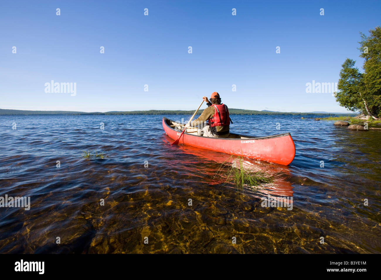 Canoeing on Maine's Brassua Lake. Near Moosehead Lake, owned by Plum