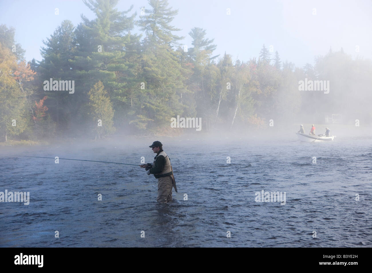 Flyfishing from a driftboat near Moosehead Lake Maine USA (MR Stock