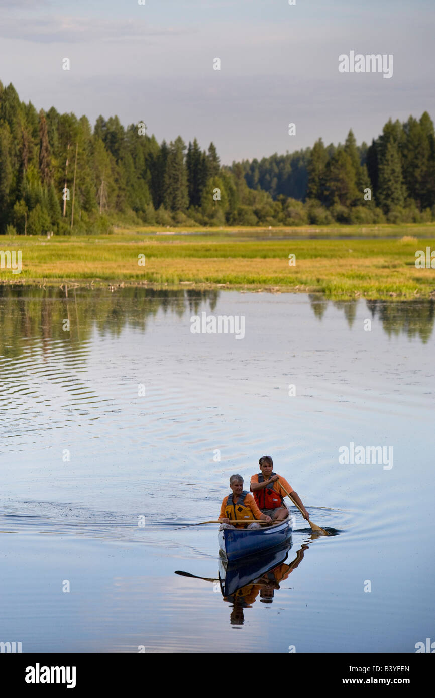 Mother and son canoeing on Upper Stillwater Lake in Montana model