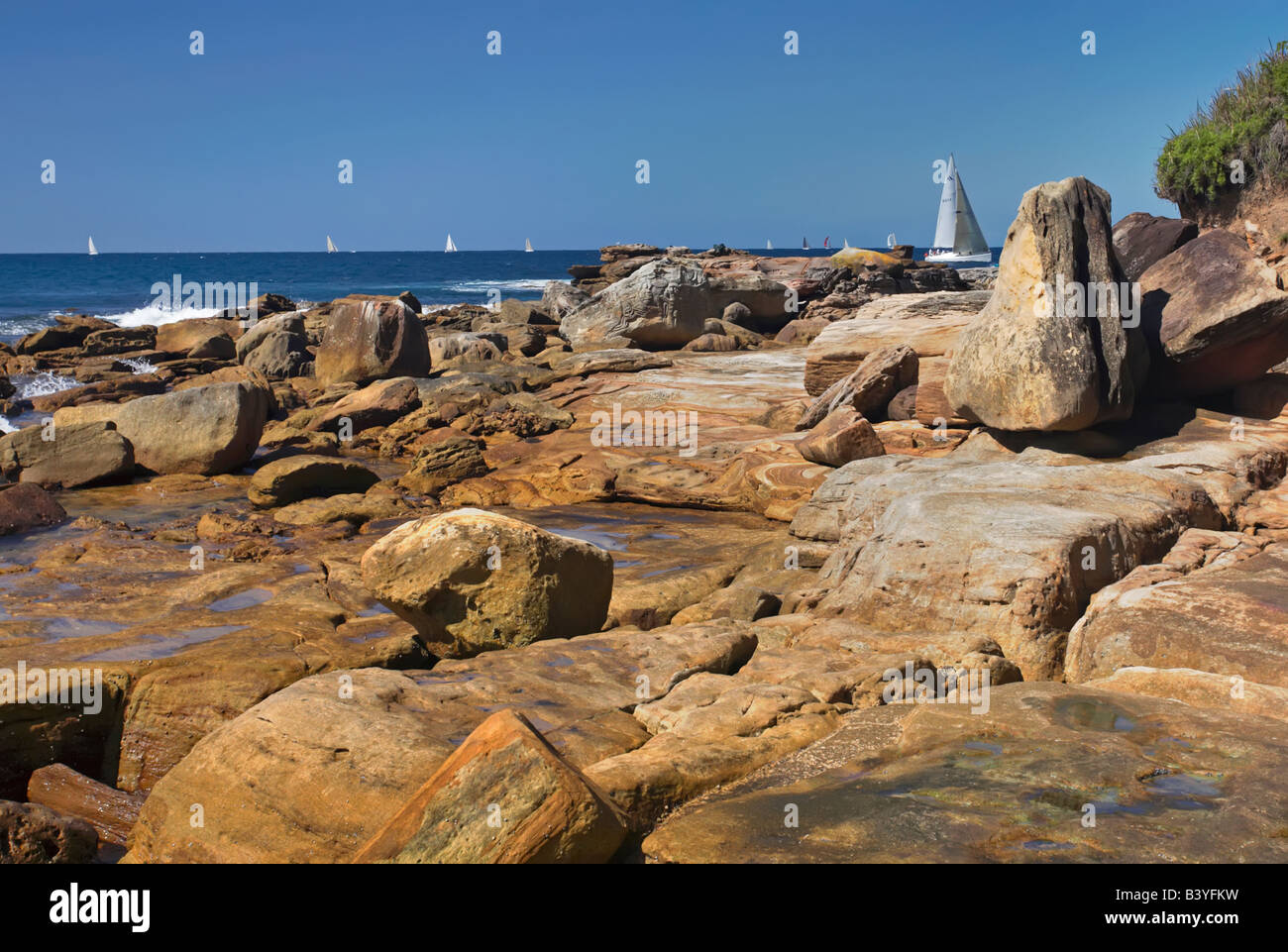 rocky sea coast travel holiday tourism seagull coastal waves yatch yatchs Stock Photo