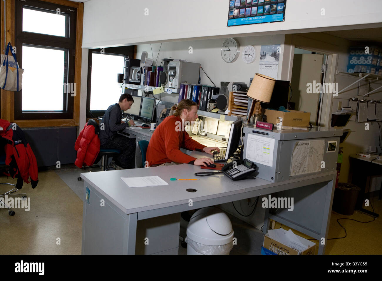 Meteorologists at work inside the Mount Washington Observatory, a