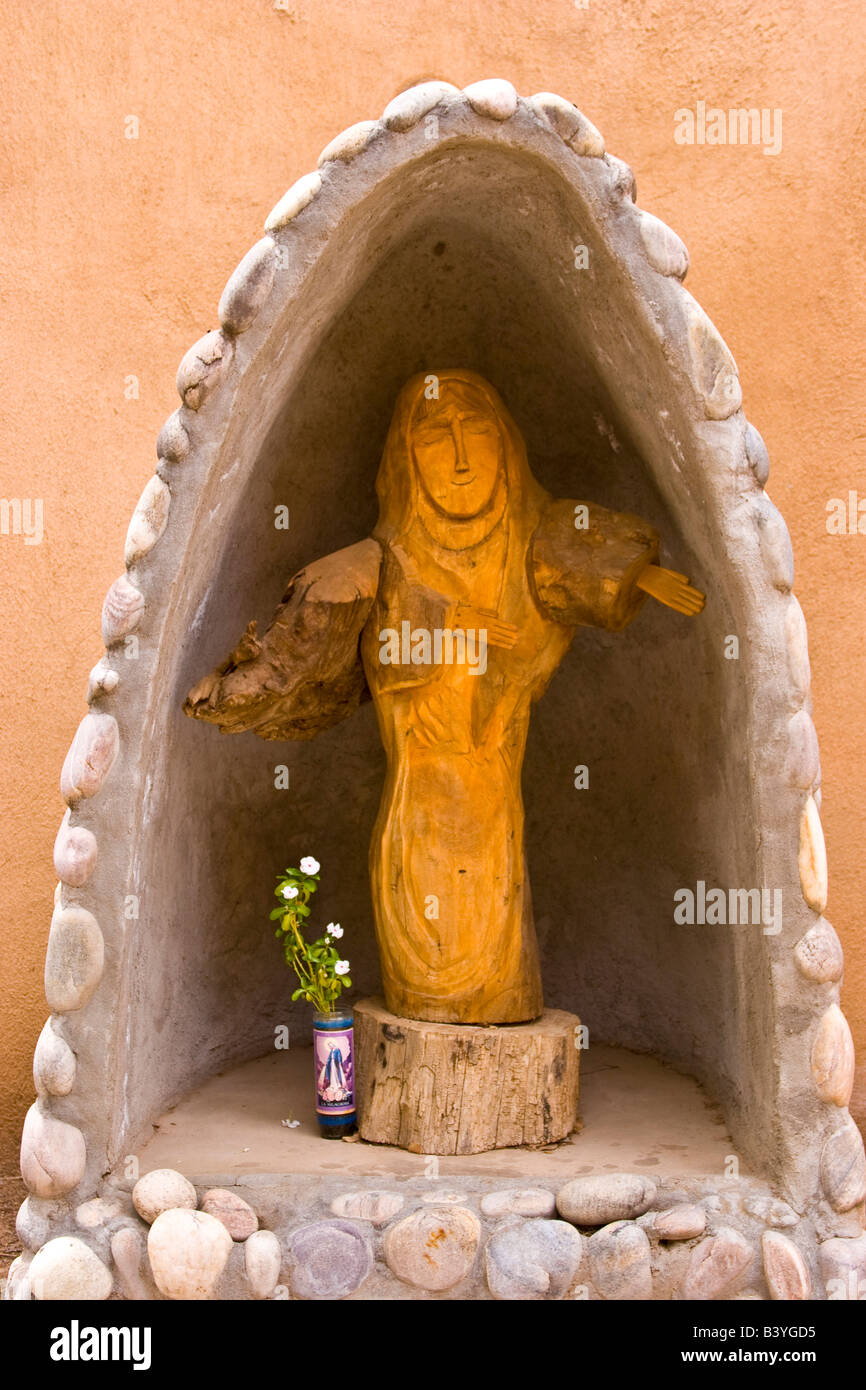 USA, New Mexico, Los Cerrillos. Religious statue in garden at St