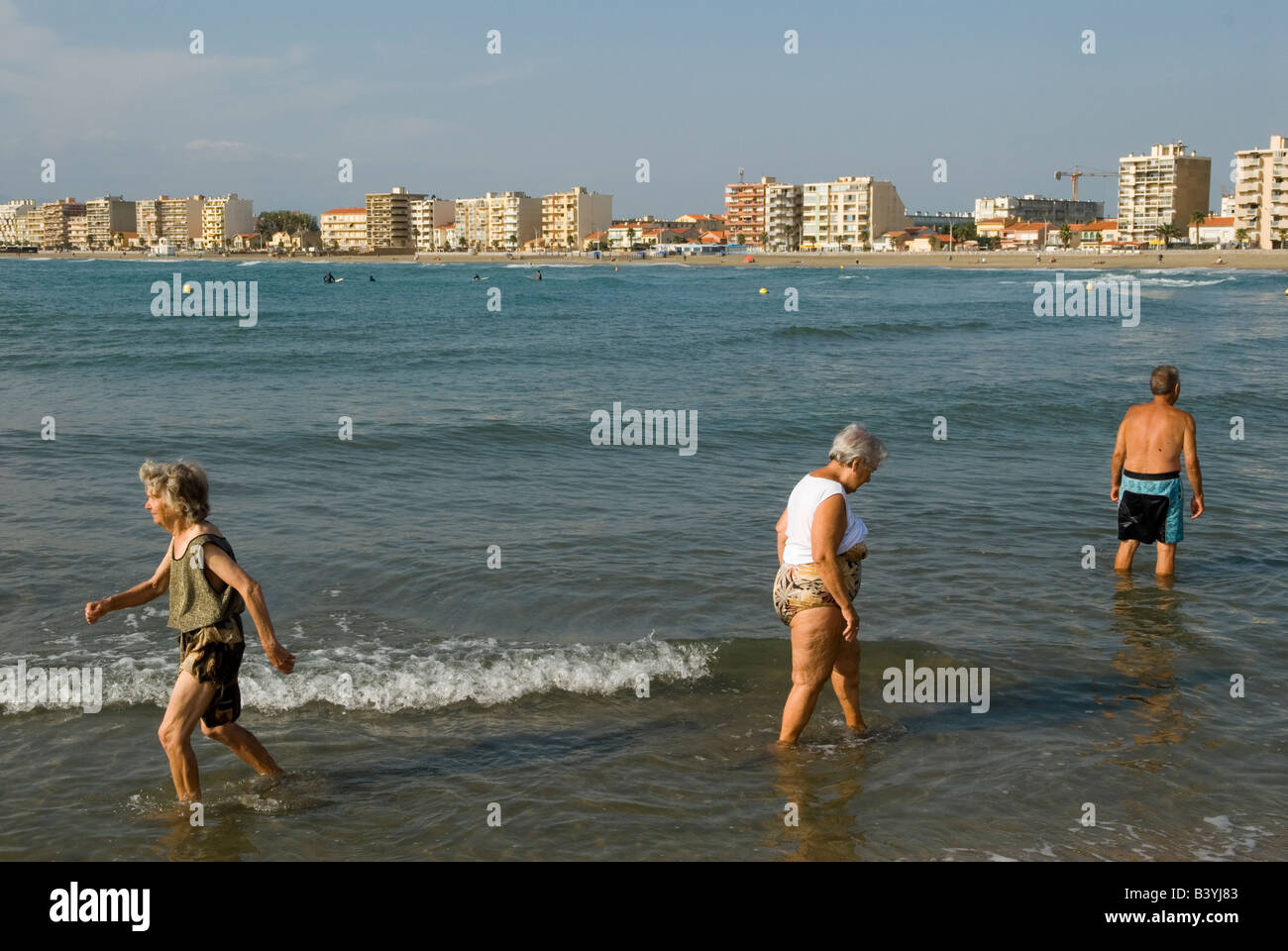 Canet Plage nr Perpignan South of France Beach scene walking through sea for exercise Stock Photo