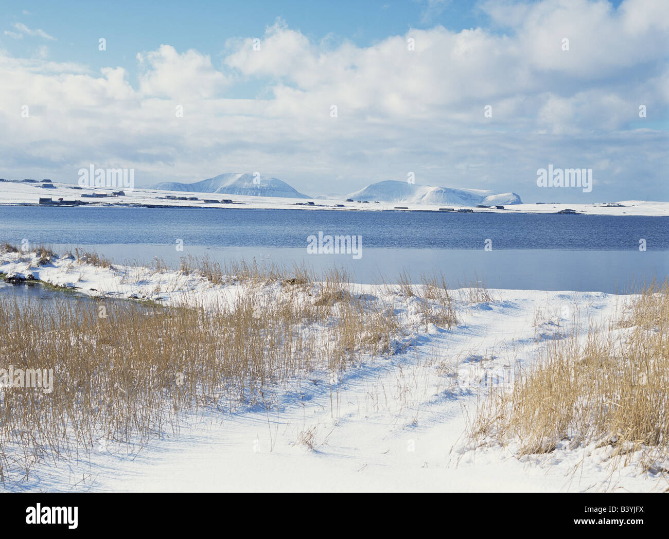 dh Loch of Stenness STENNESS ORKNEY Snow bank of loch and Hoy Hills Stock Photo
