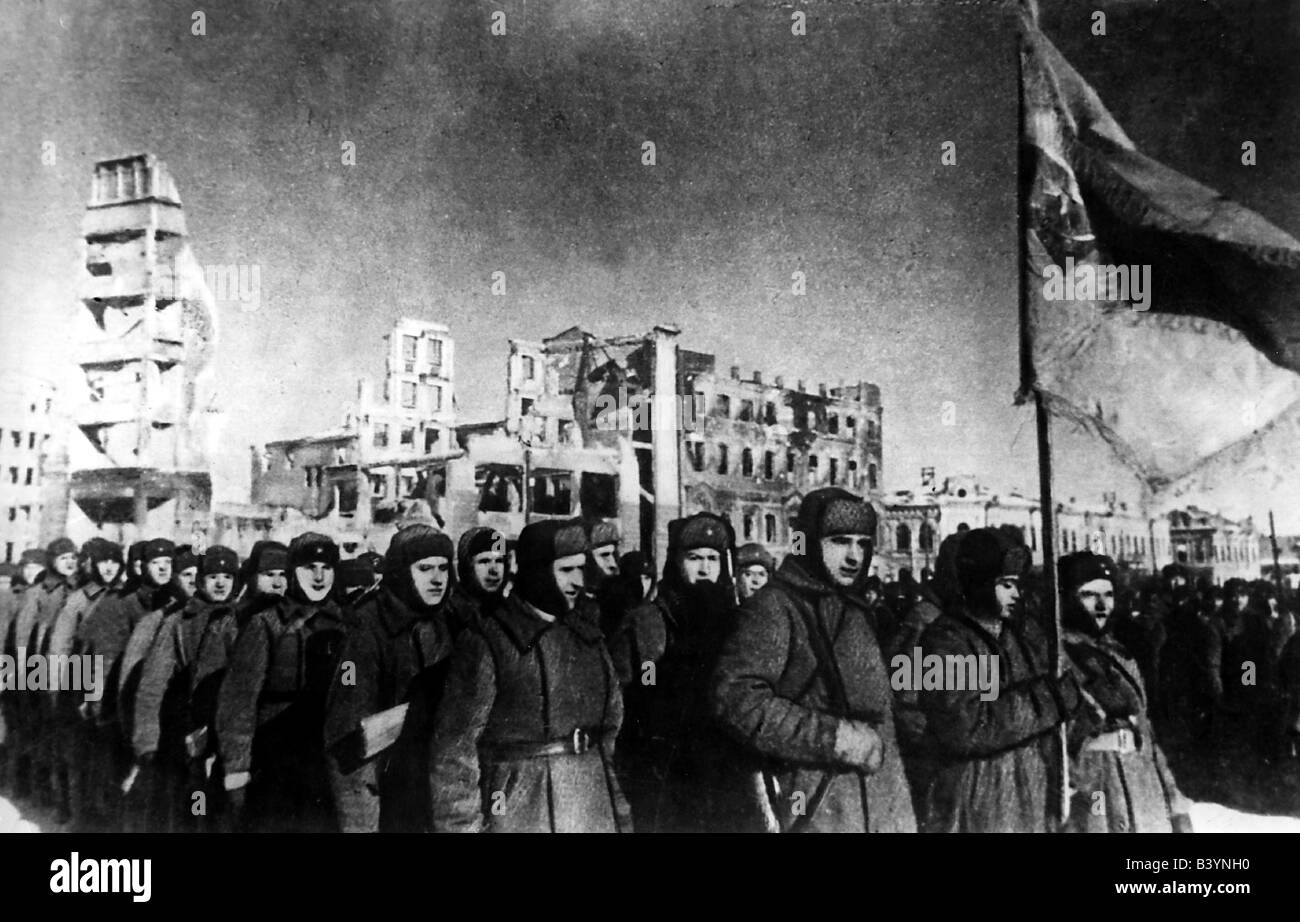 events, Second World War / WWII, Russia, Stalingrad 1942 / 1943, Sowjet victory parade after the surrender of the German 6th Army, February 1943, Soviet Union, USSR, Russian soldiers, winter, regimental colour, ruins, 20th century, historic, historical, battle, Red Army, ruin, military, 1940s, people, Stock Photo