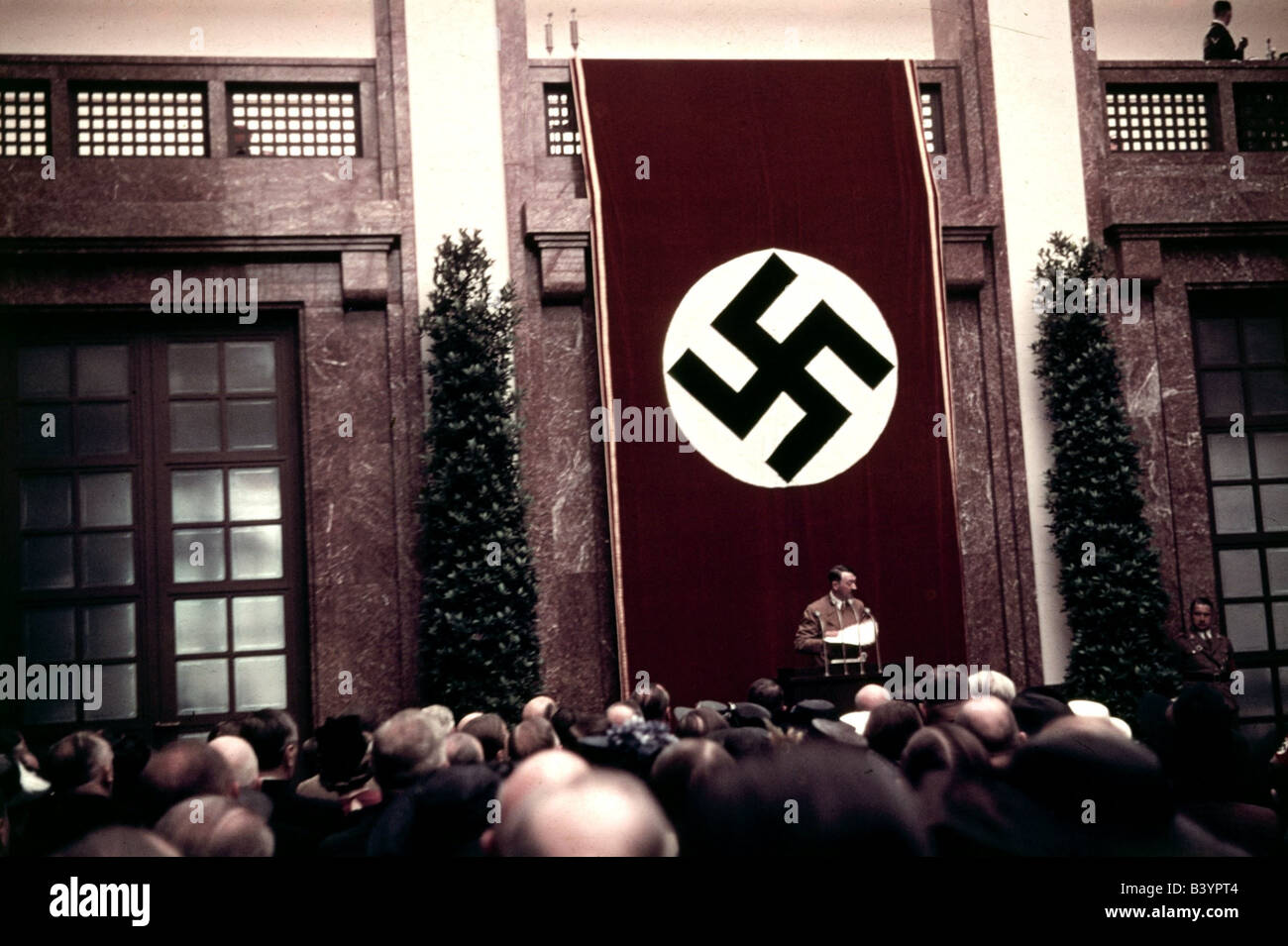 Hitler, Adolf, 20.4.1889 - 30.4.1945, German politician (NSDAP), Chancellor 30.1.1933 - 30.4.1945, speech during opening of Haus der Kunst, Munich 16.10.1938, flag, swastika, Nazi Germany, Third Reich, national socialism, nazi, 20th century, , Stock Photo