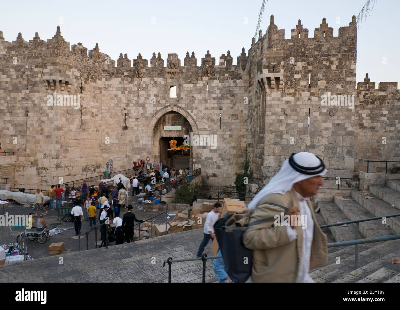 Israel Jerusalem Old City Damascus gate Palestinian man walking up the