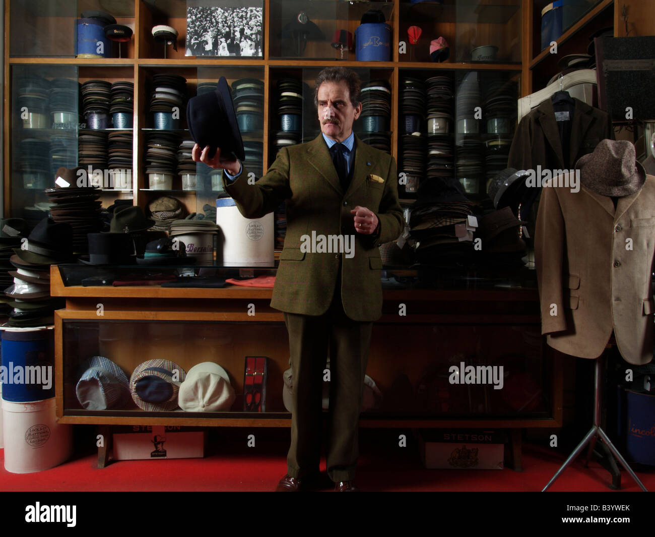 Man in traditional hat shop in Rome Stock Photo