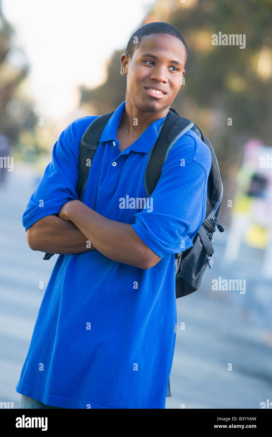 Man standing outdoors looking at something (selective focus) Stock Photo