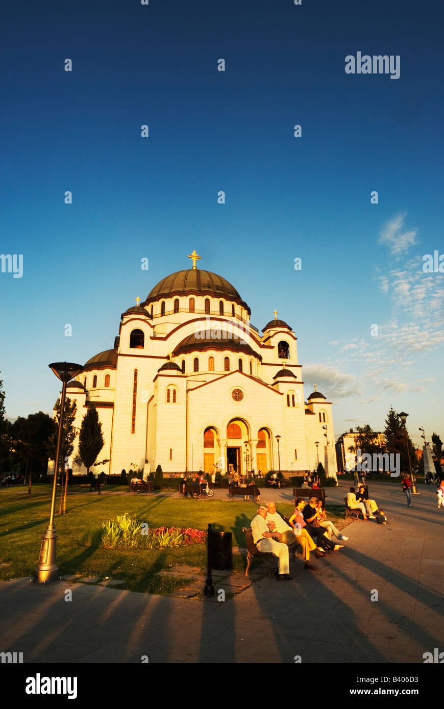 People relax in the parkland outside Sveti Sava Church, World's Biggest Orthodox Church, Belgrade, Serbia Stock Photo
