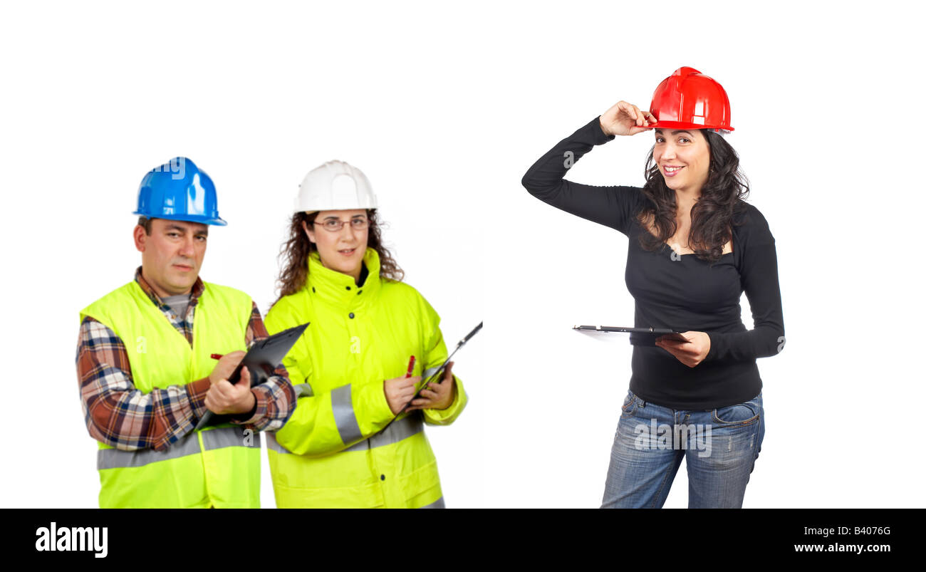 Three construction workers over a white background Focus at front Stock Photo