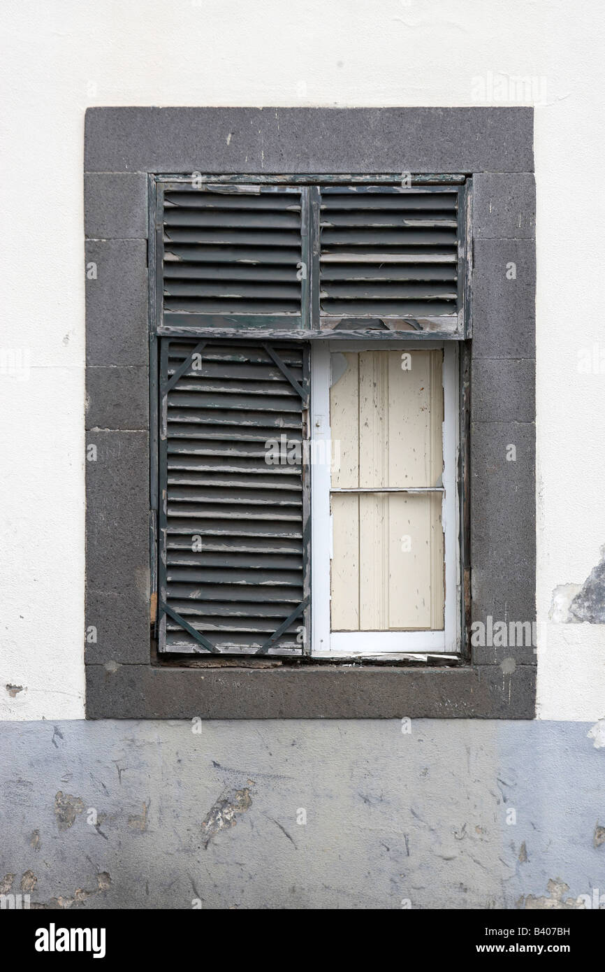 Peeling paintwork on shuttered window, Madeira, Portugal. Stock Photo