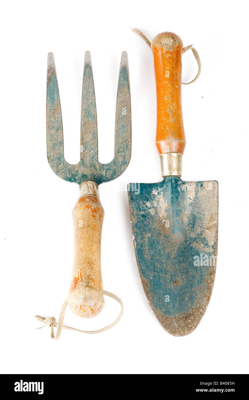A small garden fork and spade Stock Photo - Alamy