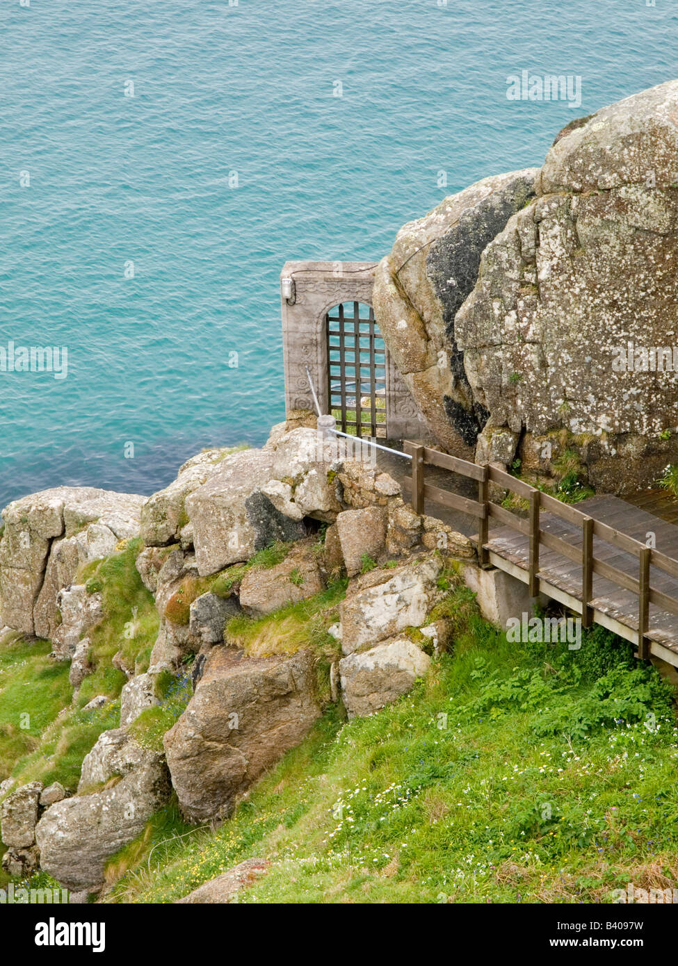 A view from the cliff top down towards the Minack Theatre near