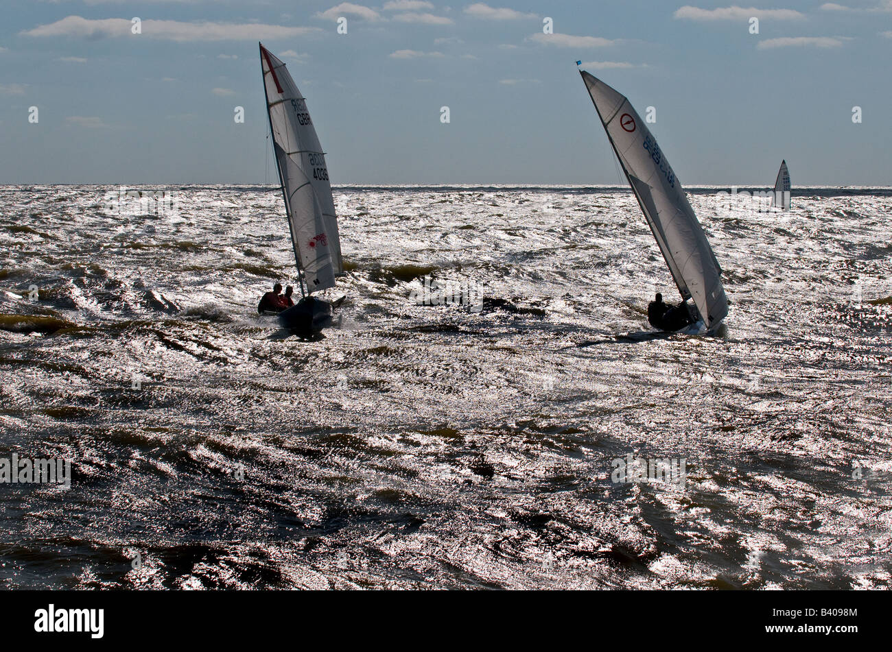 Three Sailboats racing at Southwold in Suffolk in the UK. Stock Photo
