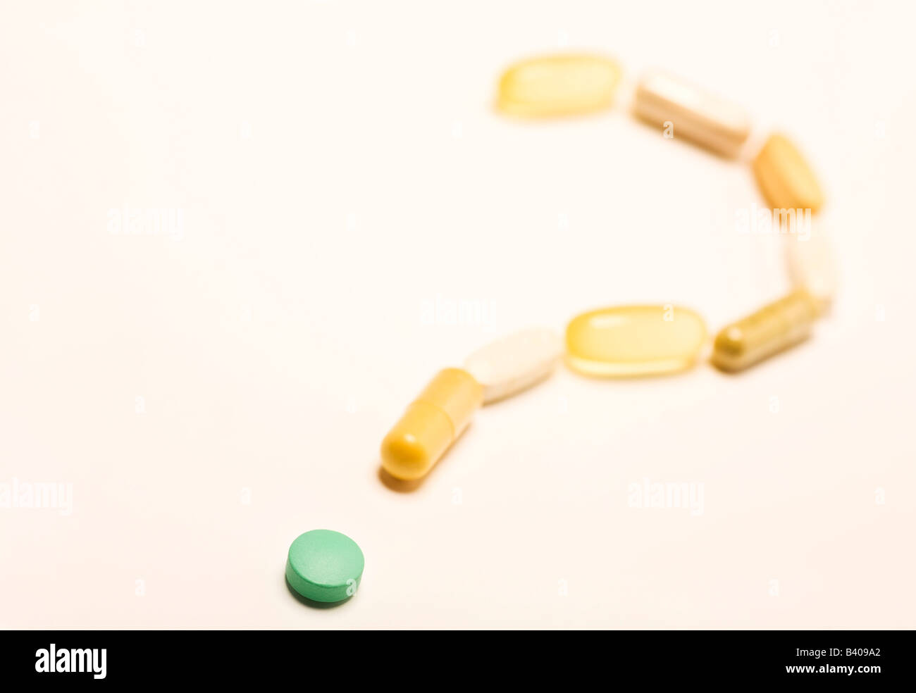 Pill and capsules forming question mark Stock Photo Alamy