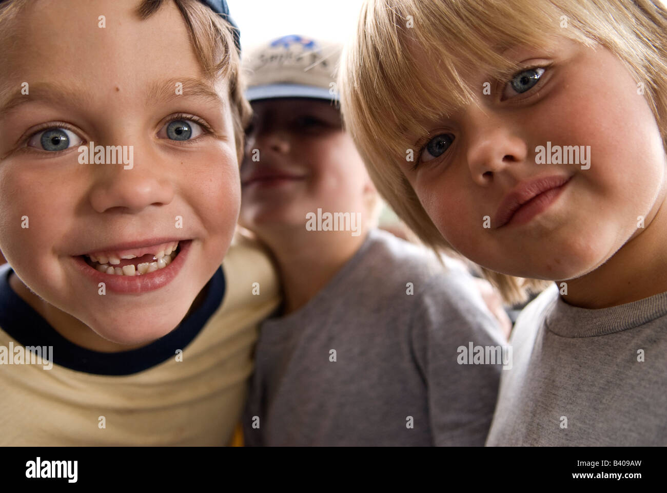 3 young boys look into the camera Stock Photo