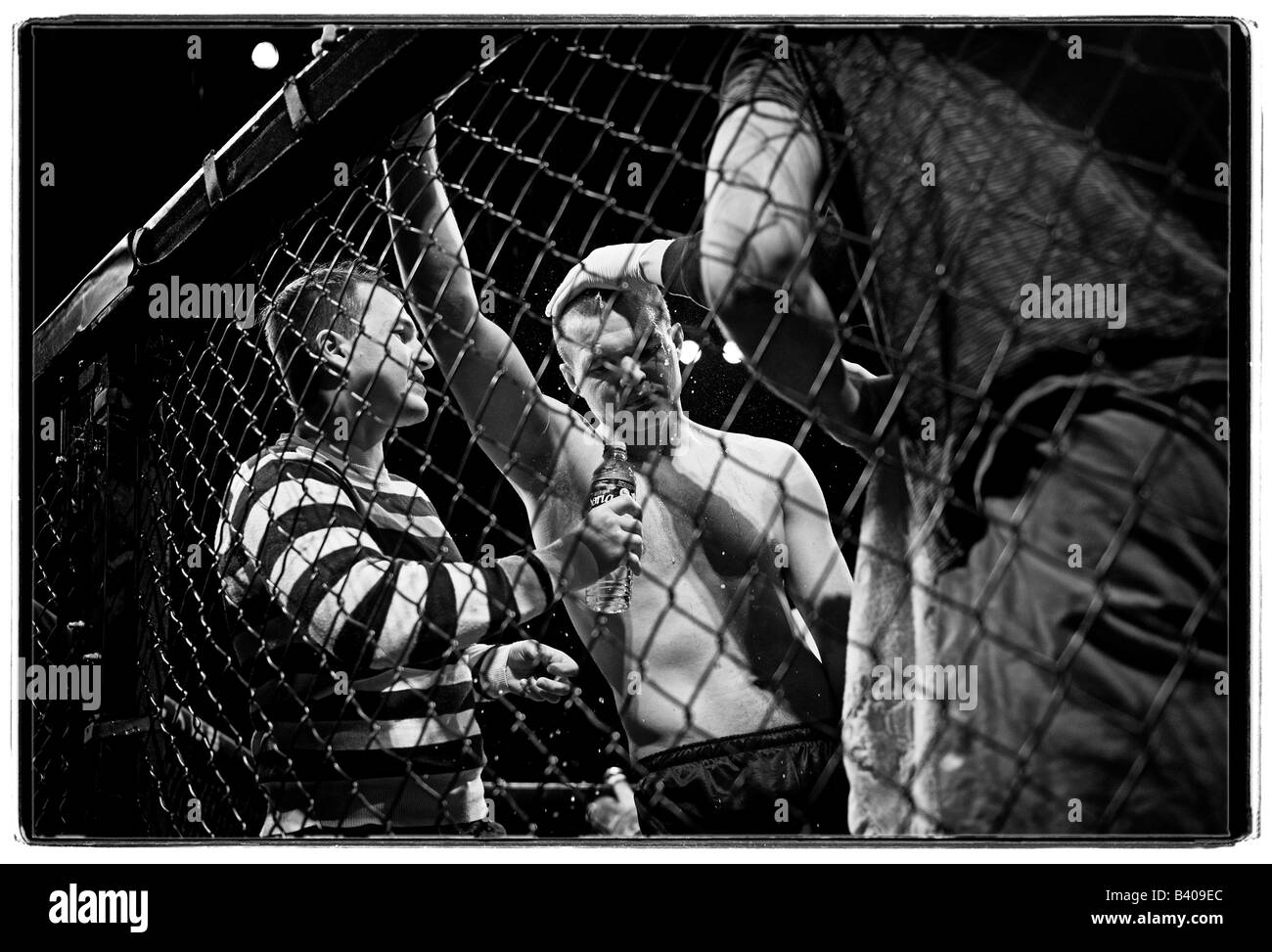 Cage fighter during break in fighting. Stock Photo